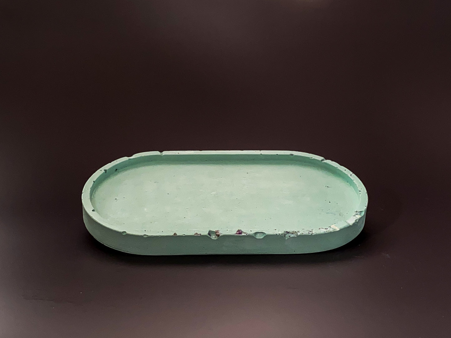 handmade concrete jewellery tray with bold design green and purple colour for modern interiors