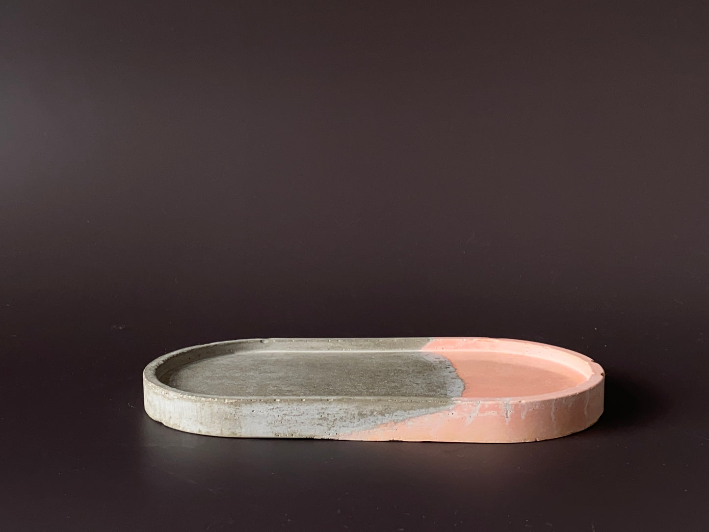 handmade concrete jewellery tray with bold design grey and orange colour for modern interiors