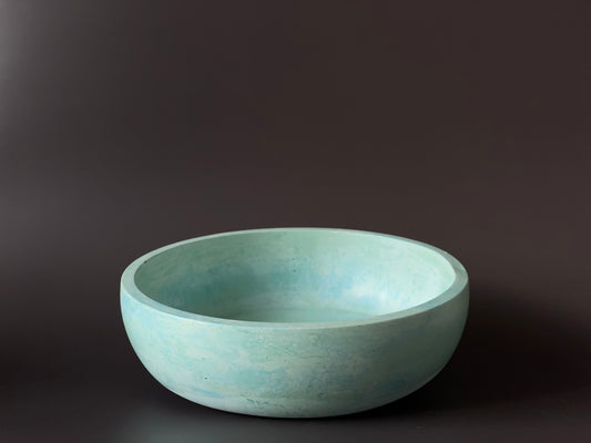 handcrafted cement round bowl with bold blue green colour for modern interior