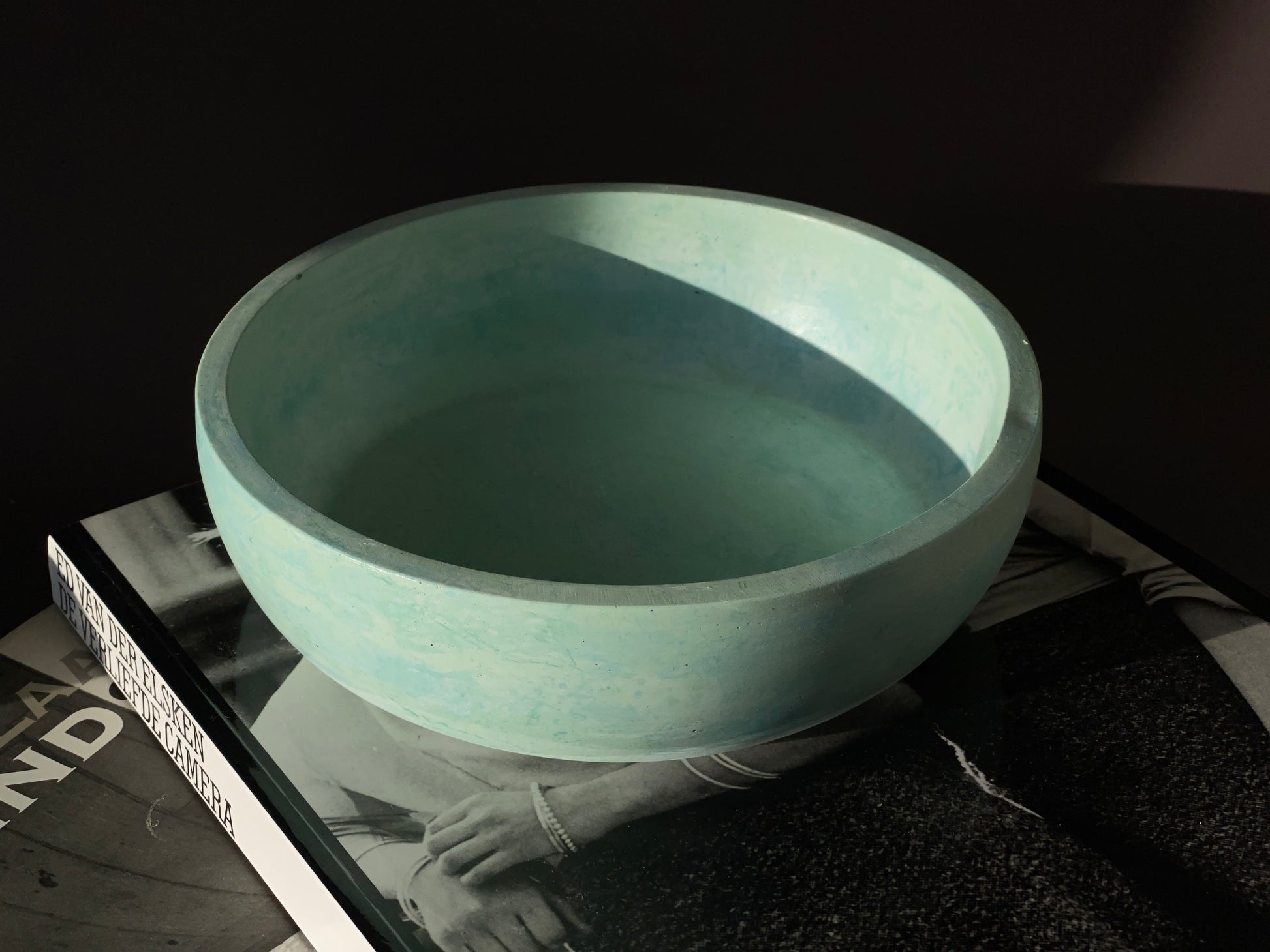 handcrafted cement round bowl with bold blue green colour for modern interior