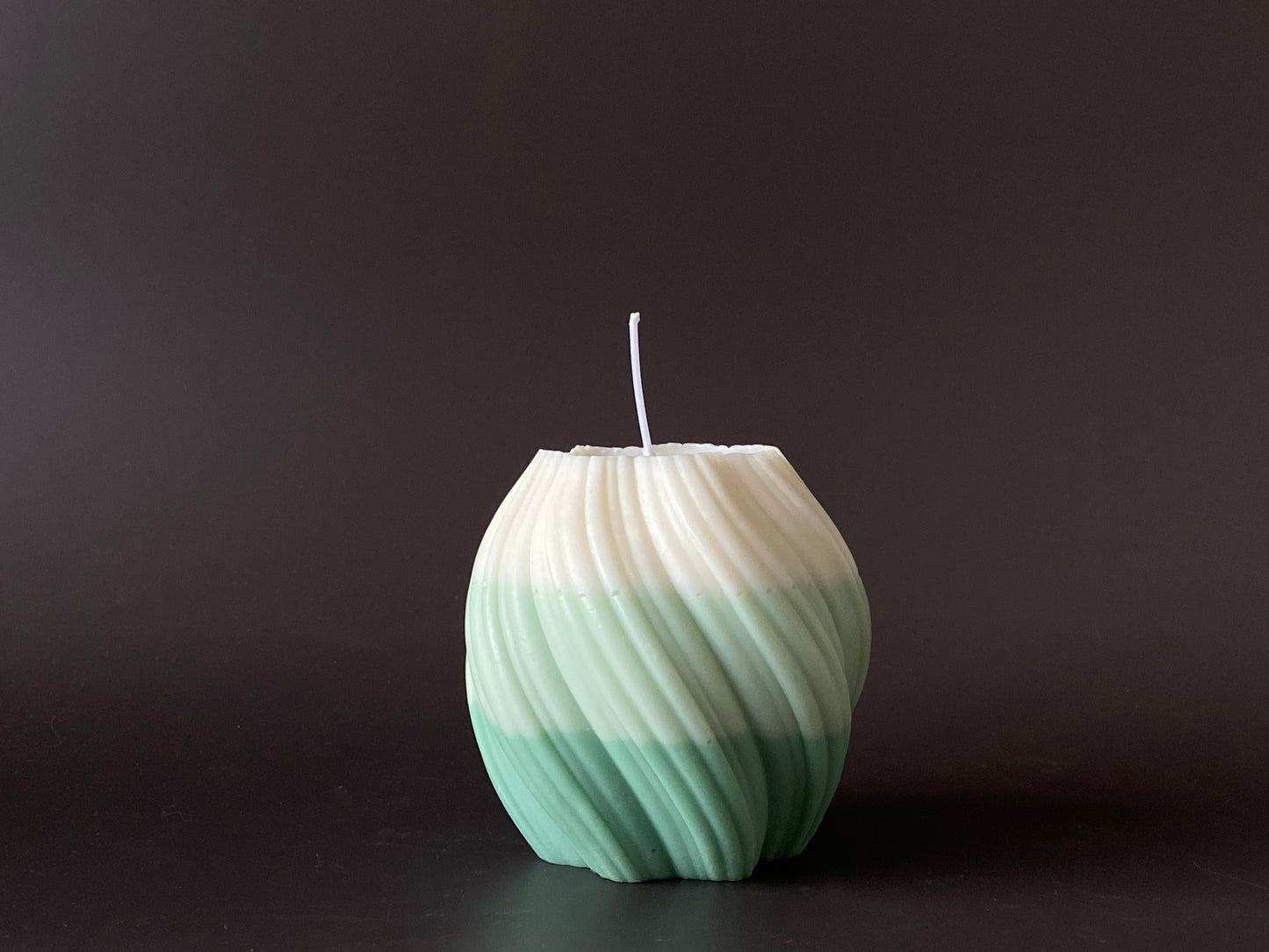 hand-poured swirl pillar candle in green and white color