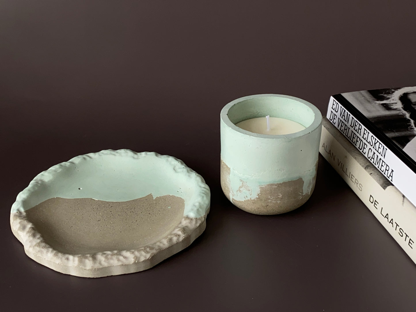 Handmade concrete round jewellery tray green and grey colour with hand-poured soy-wax candle in a handmade concrete jar green and grey colour for industrial and minimalist home decor