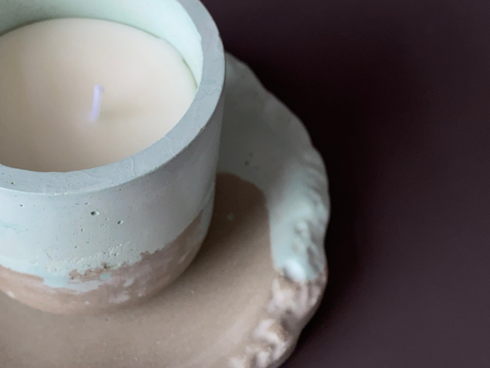 Handmade concrete round jewellery tray green and grey colour with hand-poured soy-wax candle in a handmade concrete jar green and grey colour for industrial and minimalist home decor