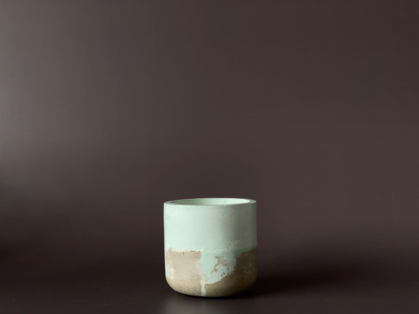 Hand-poured soy-wax candle in a handmade concrete jar for minimalist home decor