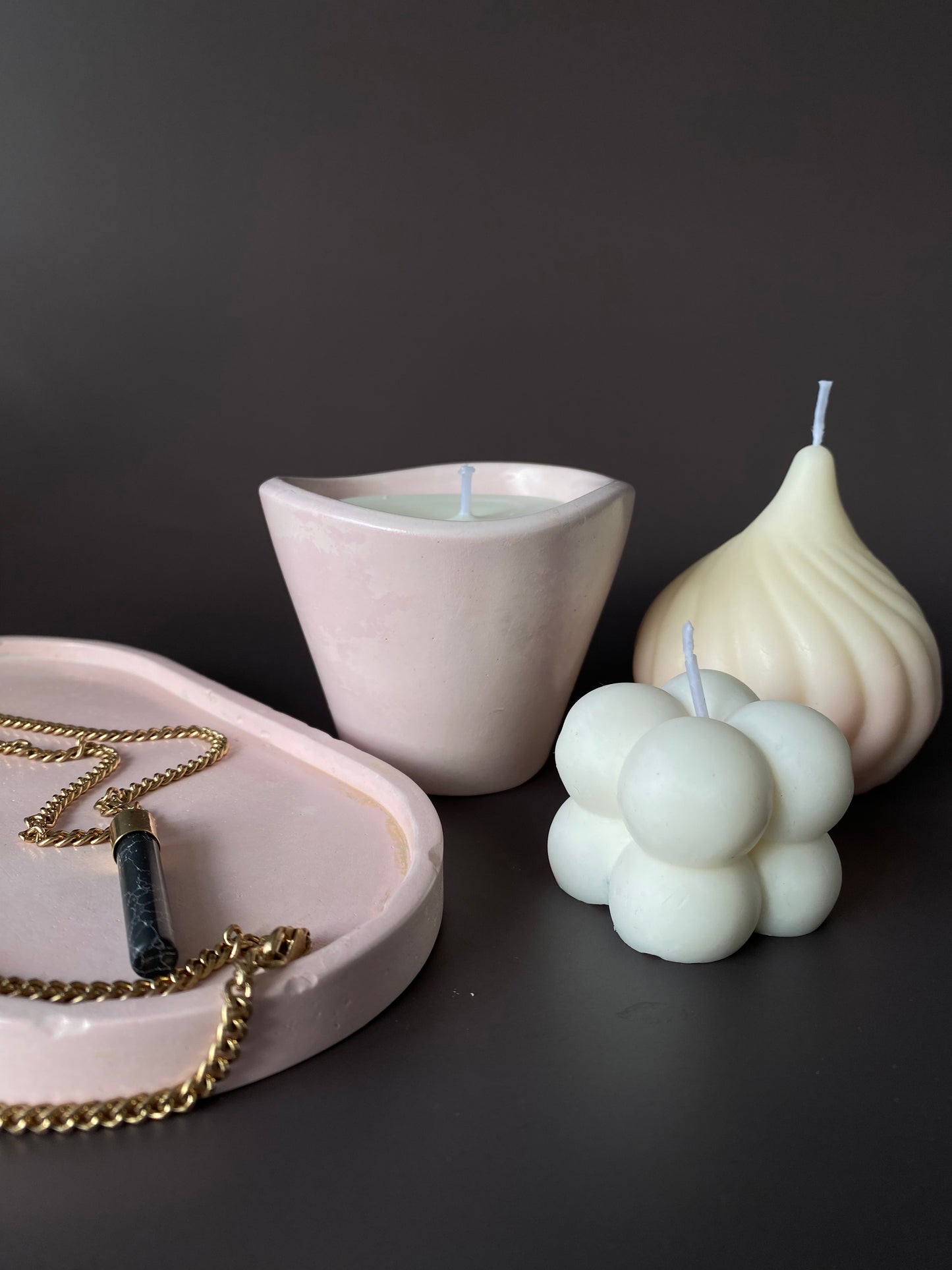 Hand-poured soy-wax candle in a handmade concrete jar for minimalist home decor