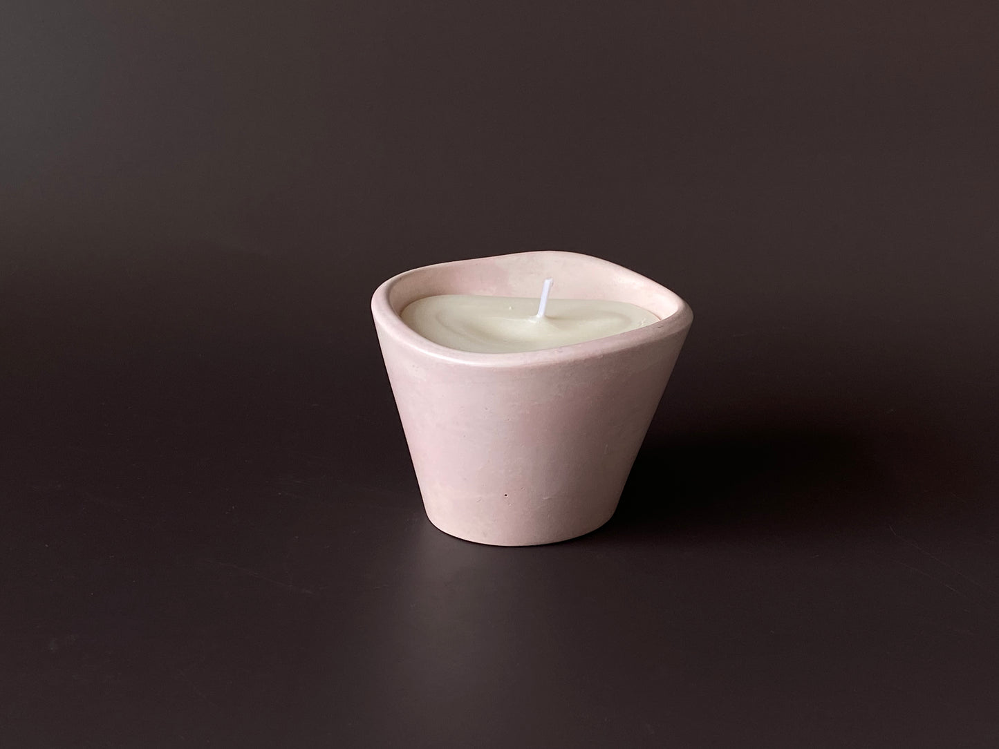 Hand-poured soy-wax candle in a handmade concrete jar for minimalist home decor